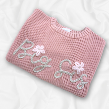 Load image into Gallery viewer, Pink sweater with &#39;Big Sis&#39; text and floral designs on a white background
